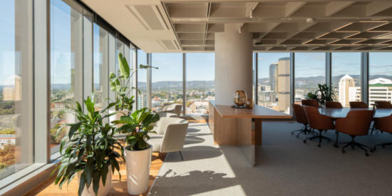 Spacious office with a panoramic view of the city, featuring a cozy lounge area and ample of natural light at Festival Tover
